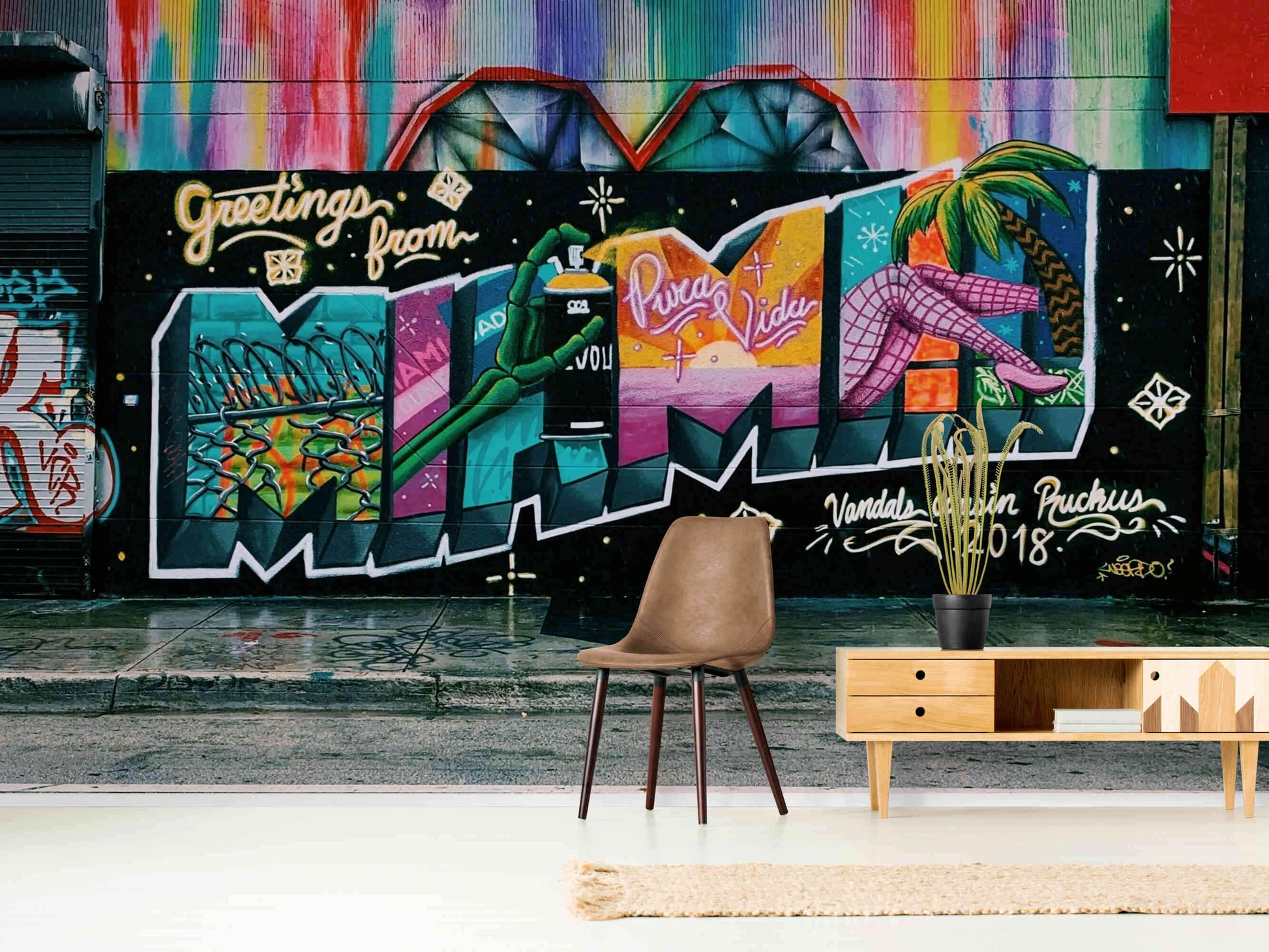 Colorful graffiti art on peel and stick wallpaper enhancing living room ambiance.