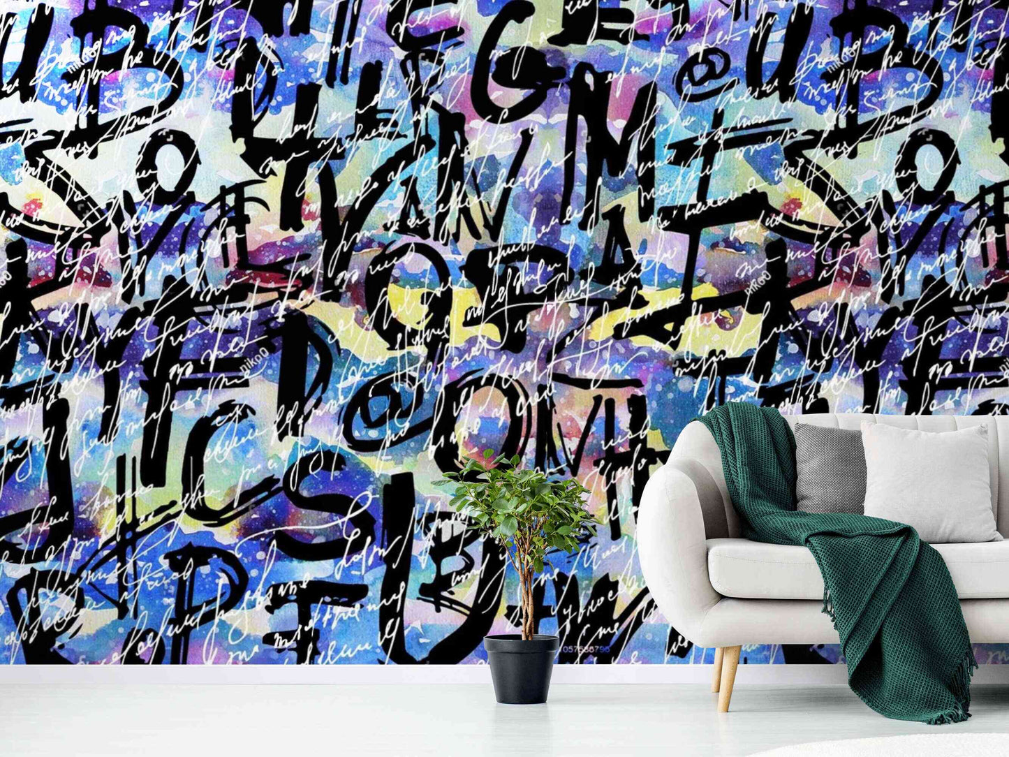 An image of a wallpaper with a graffiti mural design in various colors, including shades of blue, green, pink, orange, and yellow. The design features bold, abstract shapes and lines that resemble street art. The wallpaper is removable, making it easy to install and remove without leaving residue or damaging the wall surface.
