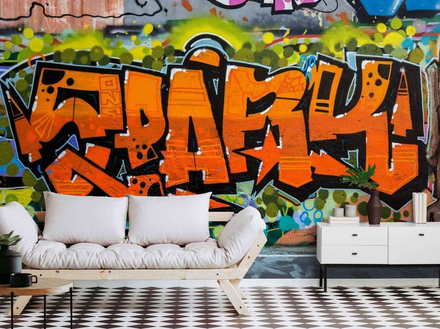 An image of a wallpaper with a graffiti design in various colors, including shades of orange, green, pink, and yellow. The design features bold shapes, lines, and lettering, resembling traditional street art. The wallpaper is used to decorate a teenage bedroom, creating a trendy and urban atmosphere. The design is eye-catching and adds personality and character to the room.