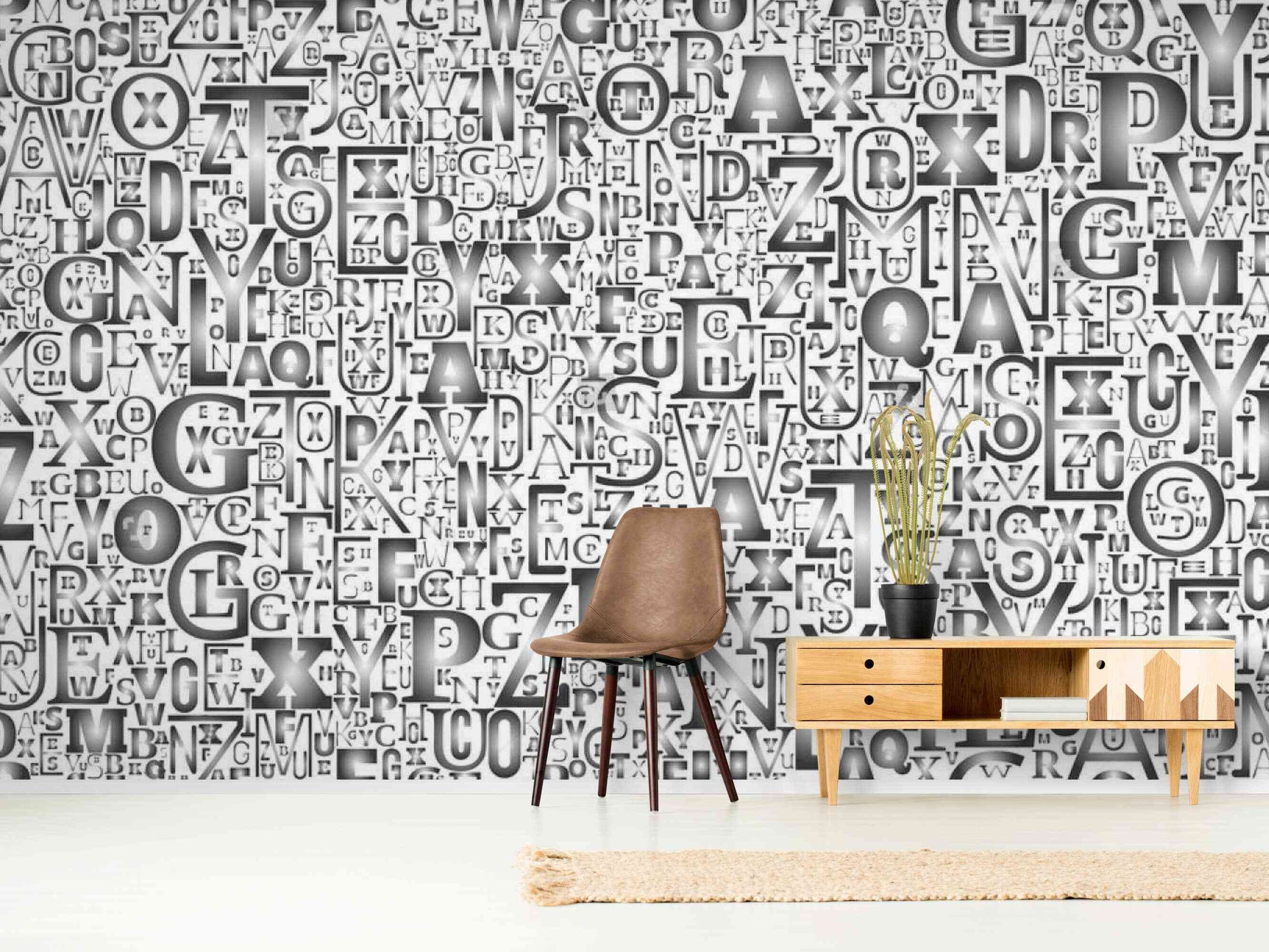 A gray graffiti wall decal with letters and symbols