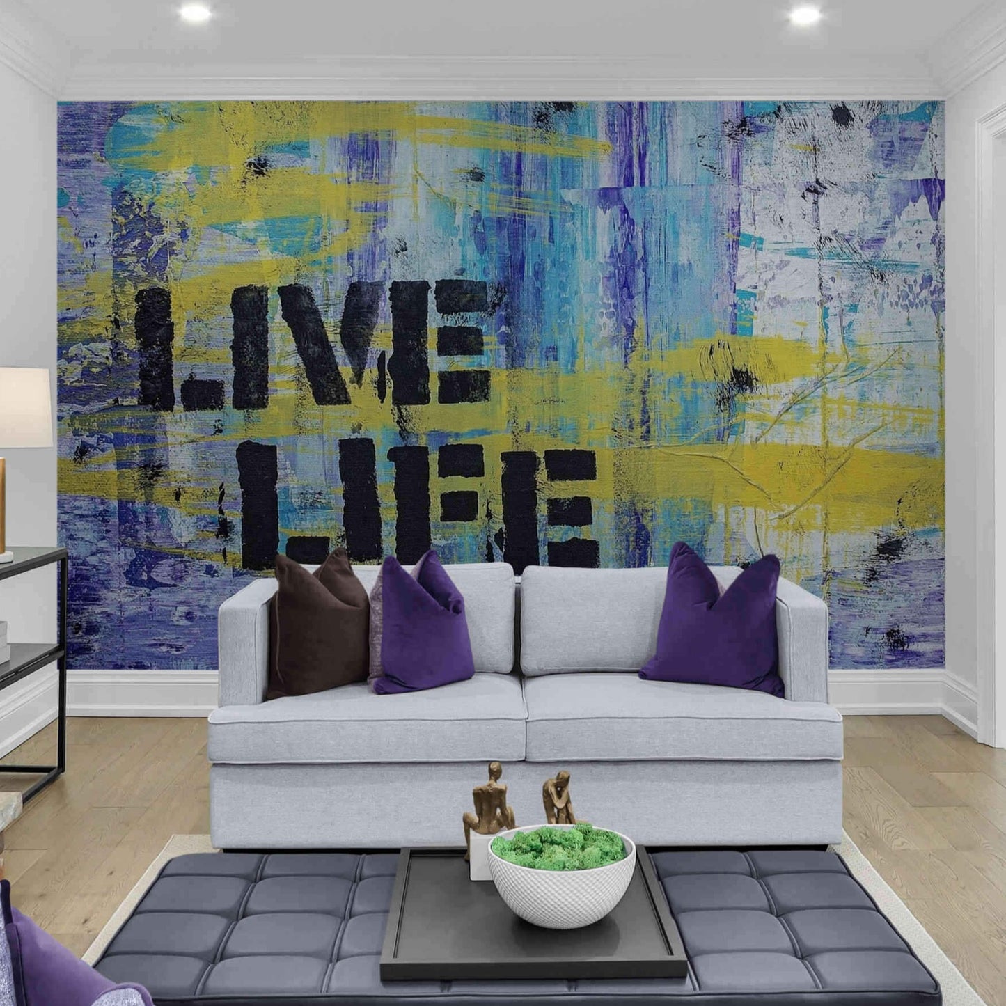 Vibrant 'Live' inscription on a contrasting blue and yellow graffiti wall mural.