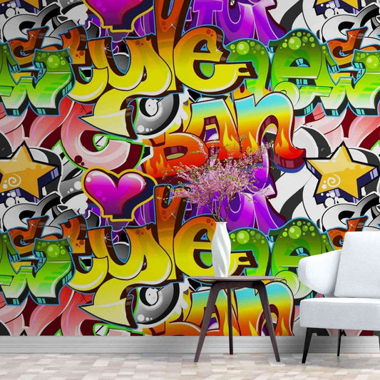 An image of a wallpaper with a street art graffiti design in various colors, including shades of red, green, blue, and yellow. The design features bold shapes, lines, and lettering, resembling traditional graffiti art. The wallpaper is suitable for any room in a house or commercial space, adding a touch of urban and artistic vibe to the decor.