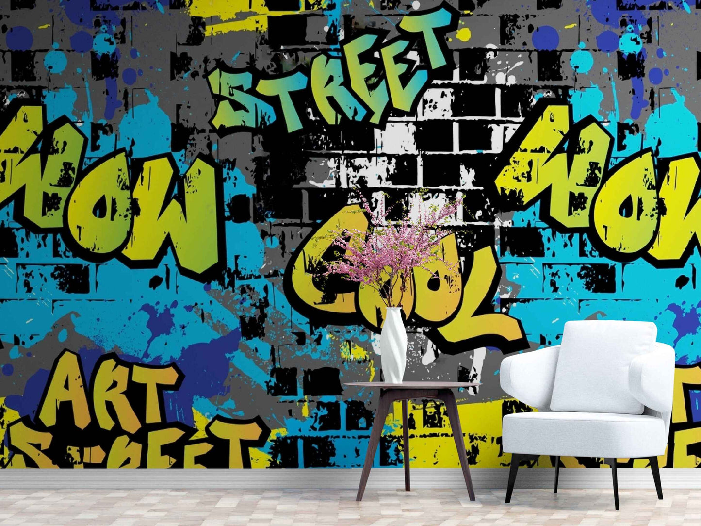 An image of a wallpaper with a street art graffiti design in various colors, including shades of blue, red, and yellow. The design features bold shapes, lines, and lettering, resembling traditional graffiti art. The wallpaper is available from the Accent Wallpapers Shop, a retailer specializing in unique and creative wall coverings. The wallpaper is suitable for accent walls in any room, adding a touch of urban and artistic vibe to the decor.