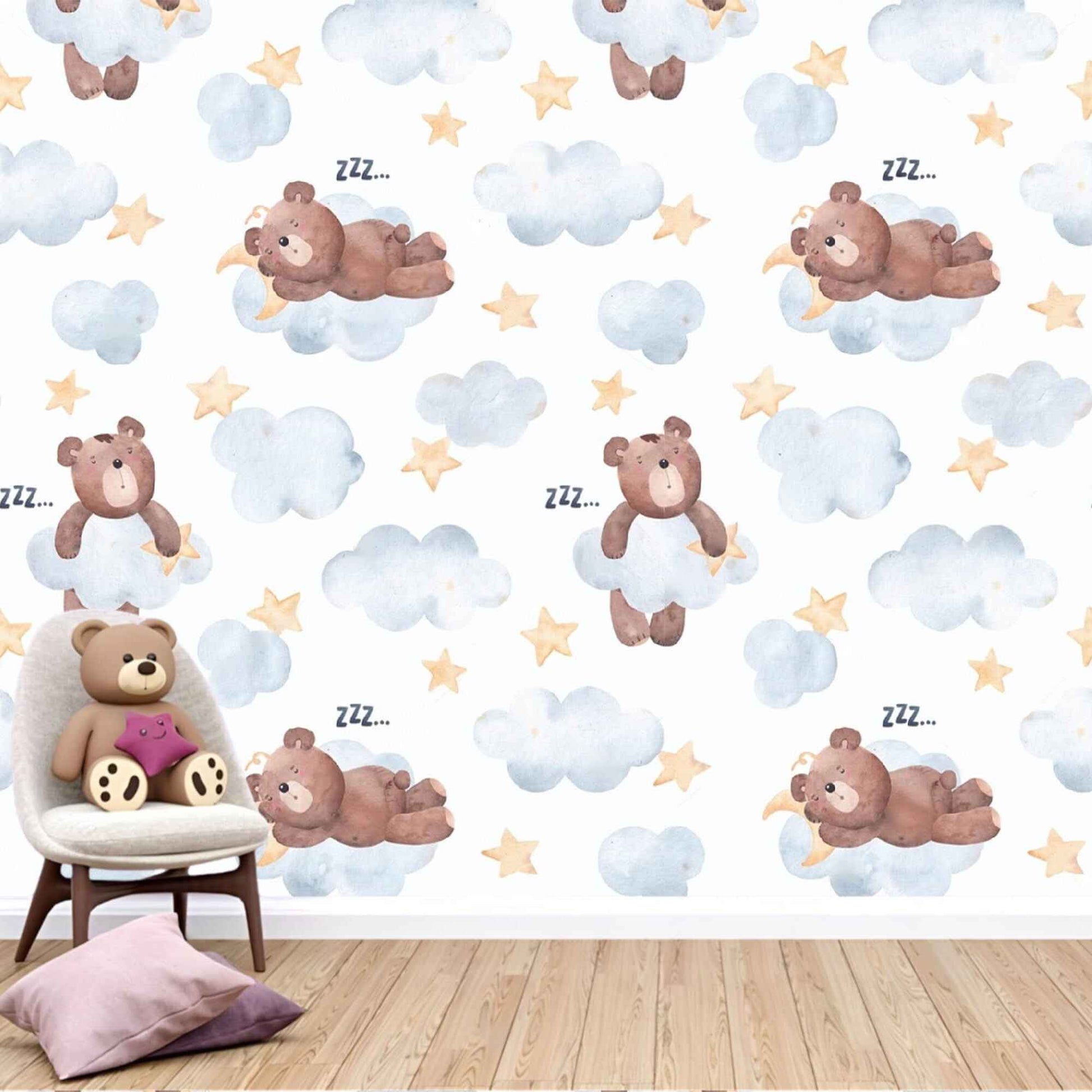 Teddy bear on clouds wallpaper in a baby's nursery, creating a whimsical and serene atmosphere.